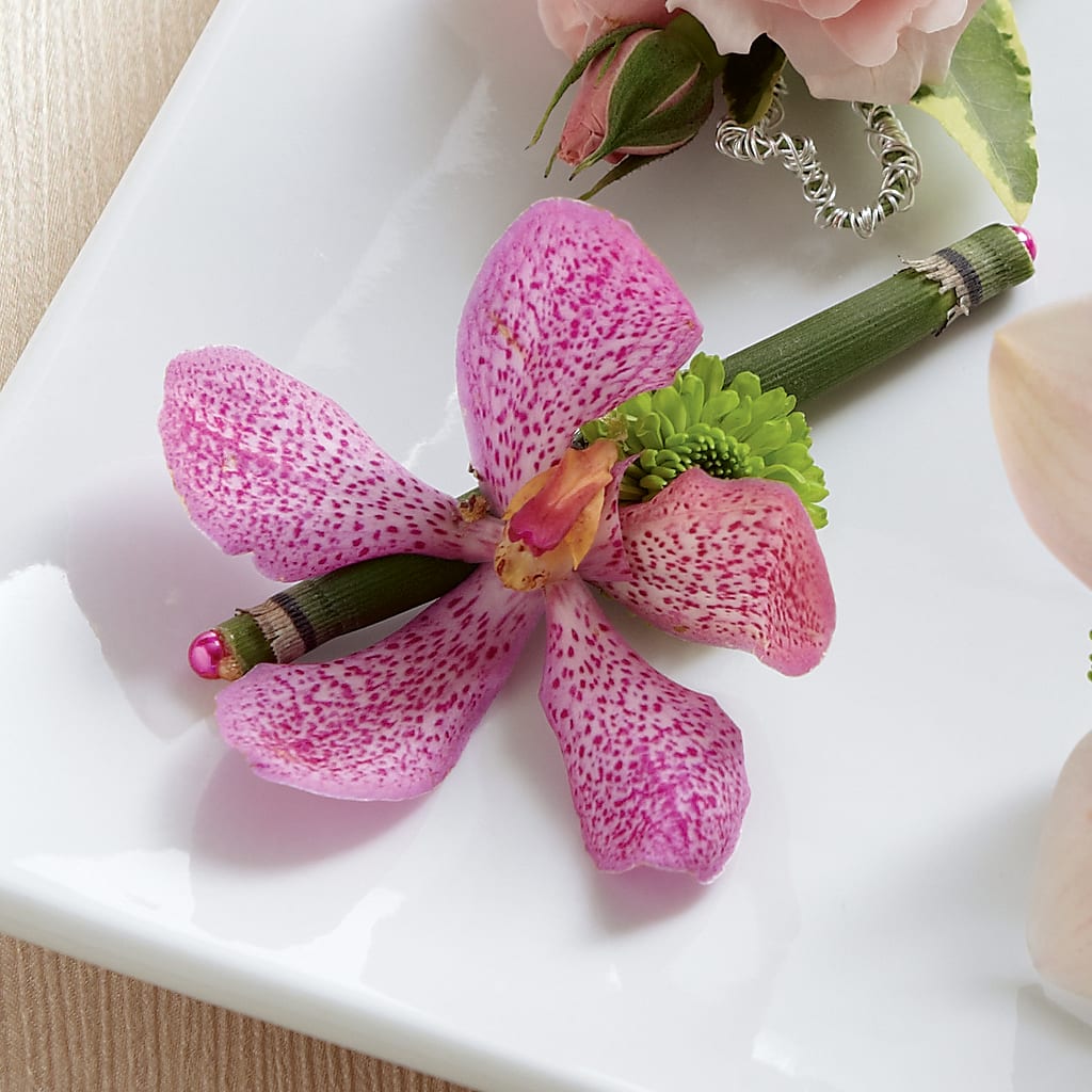 Pink Mokara Boutonniere – Berkeley Florist, Moncks Corner SC